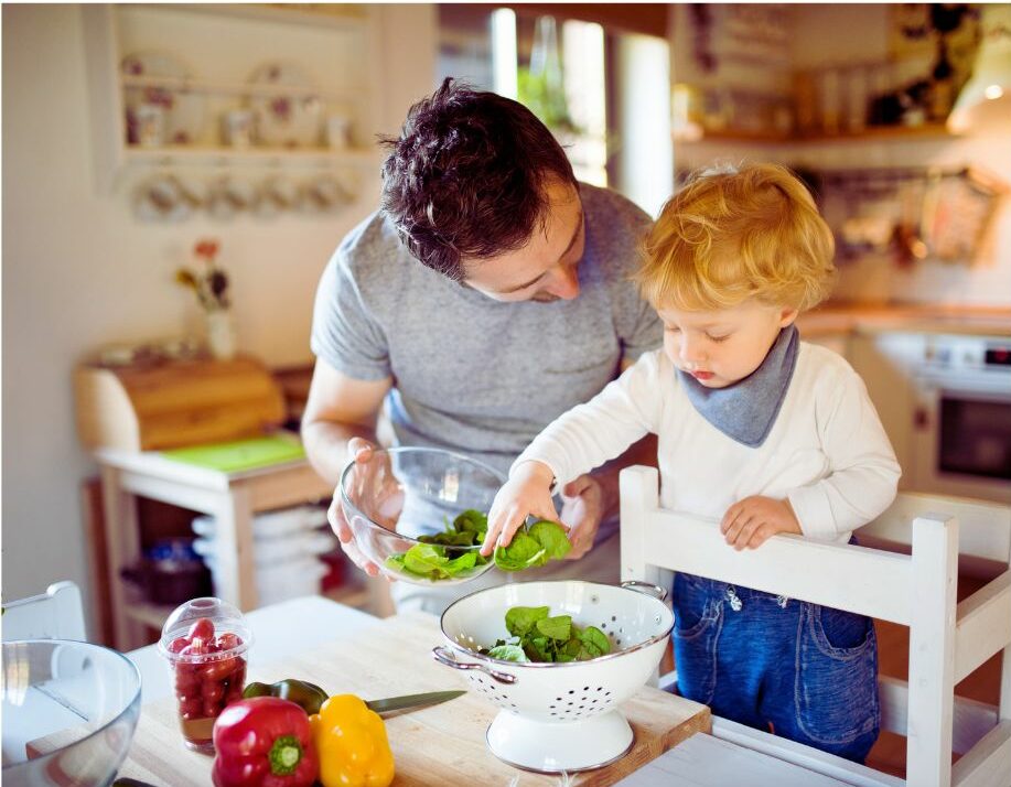 Parent and Child making salad